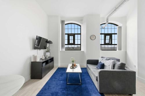 a living room with a couch and a table at Characterful 1 Bed Apartment in Central Nottingham in Nottingham