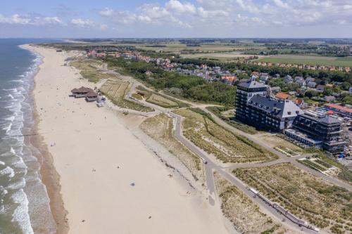 an aerial view of a beach and the ocean at Duinhof in Cadzand-Bad