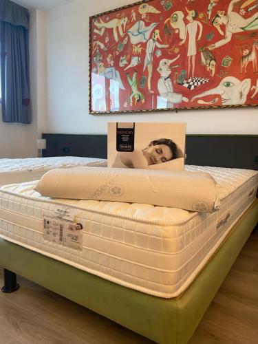 a mattress with a picture of a man on it at Green Hotel in Poviglio