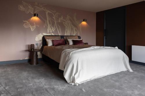 a bedroom with a large bed in a room at Park Lofts Groningen in Groningen