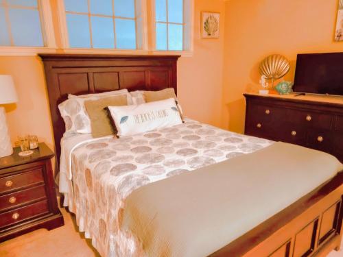 a bedroom with a large bed and a television at 2 Bd, Oceanfront Oasis, Lots of deals and Winter Texans book early in Galveston