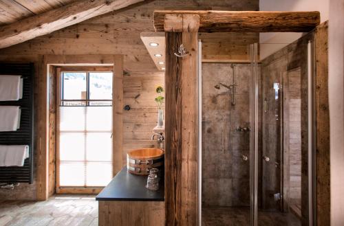 a bathroom with a shower and a sink at Alpin Chalets Oberjoch in Bad Hindelang
