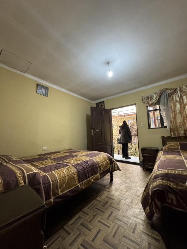 Llit o llits en una habitació de De Compania Hostal - Bed, Breakfast & More