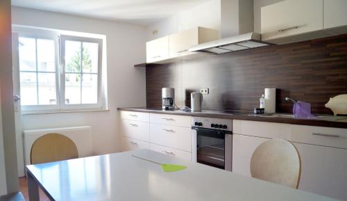a kitchen with a table and a counter top at Ferienhaus Flora in Pirna