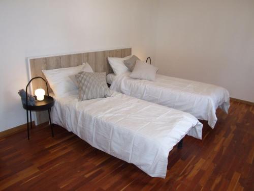 two beds sitting next to each other in a room at Marconi 33A in Pergine Valsugana