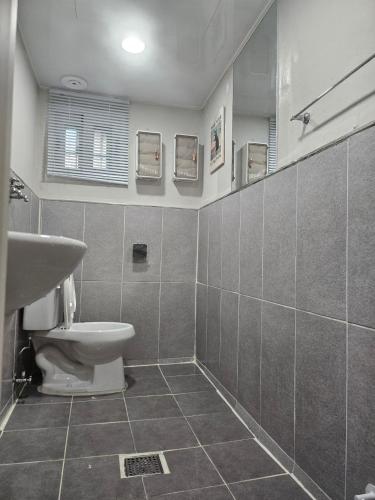 a bathroom with a toilet and a sink at STAY Humming in Seoul