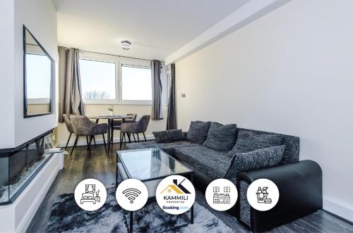 a living room with a couch and a table at 1BR Apartment By Kammili Properties - Near City Centre, Universities & Hospital in Manchester
