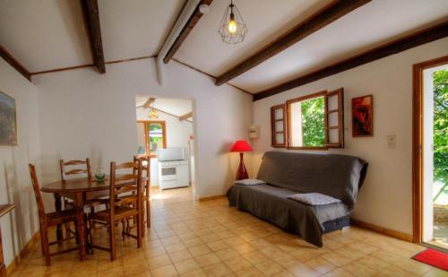 a living room with a couch and a table at Casa Lisandru in Croce