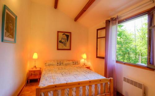 a bedroom with a bed and two windows at Casa Lisandru in Croce