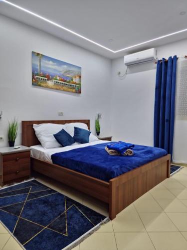Postel nebo postele na pokoji v ubytování Orange Apartment