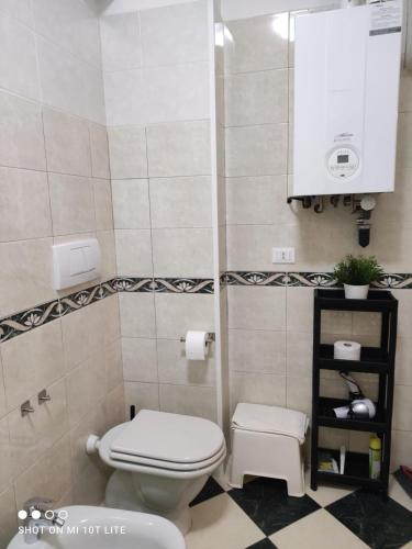 a small bathroom with a toilet and a sink at amaRE in Reggio Emilia