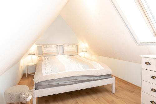 a bedroom with a bed in a attic at Ferienhaus Ostsee in Pruchten