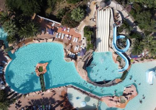 an aerial view of a pool at a resort at Camping Les Sables d'Or Pirates World - Aquatique Vacances in Le Grau-dʼAgde