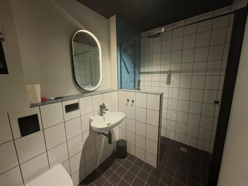 a bathroom with a sink and a mirror at KulturHaus Locktow in Locktow