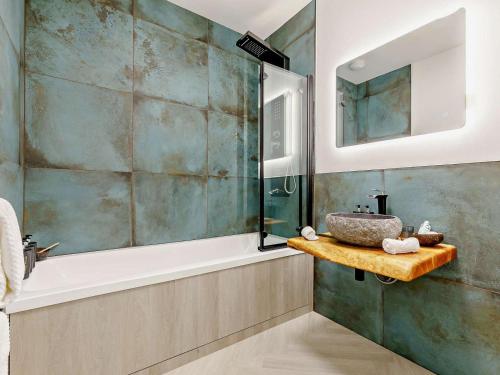 a bathroom with a sink and a shower and a tub at 3 Bed in Newquay oc-90070 in Newquay