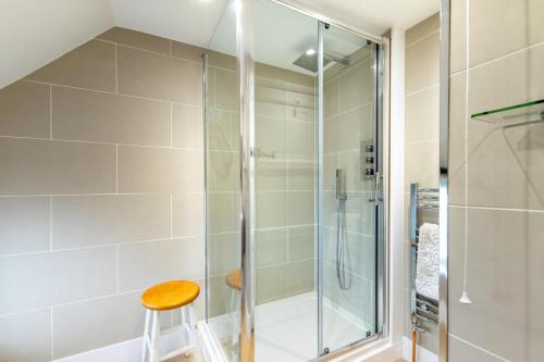 a shower with a glass door in a bathroom at 1 Bed in Tenterden oc-66342 in Tenterden