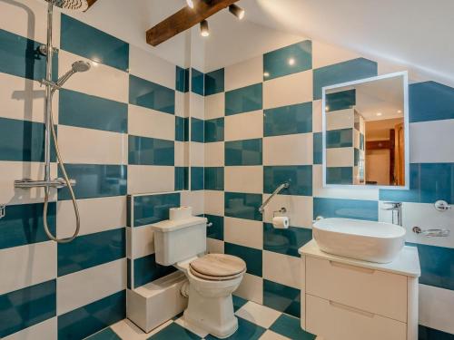 a bathroom with a toilet and a sink and a shower at 4 Bed in Eastbourne oc-71297 in Eastbourne