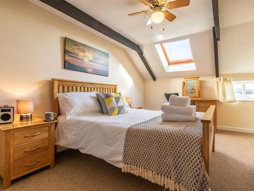 a bedroom with a bed and a ceiling fan at 2 Bed in Helston oc-41378 in Cury