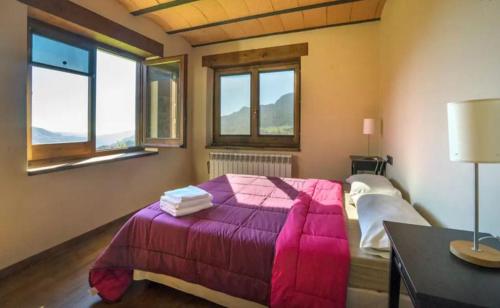 Postel nebo postele na pokoji v ubytování CasaCampelles II - Vall de Núria - Ripollès