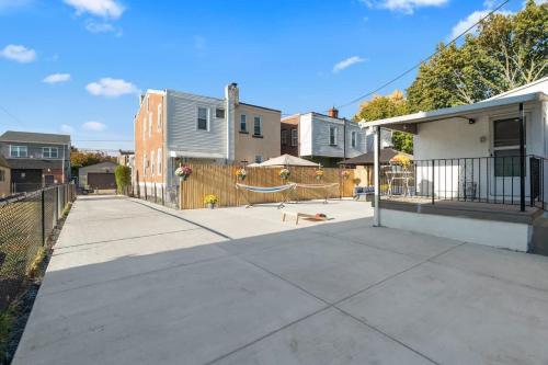 a sidewalk in front of a house with a fence at Oasis Spacious-Private Parking 16 Beds 29 Guests in Philadelphia