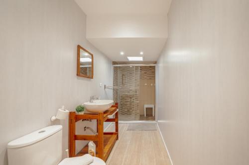 a bathroom with a sink and a toilet at Douro Views Terrace House by Vacationy in Bandeira