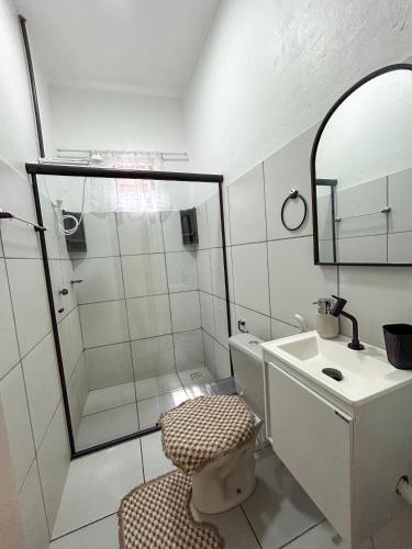 a bathroom with a shower and a toilet and a sink at Ksa Sodré in Barreirinhas