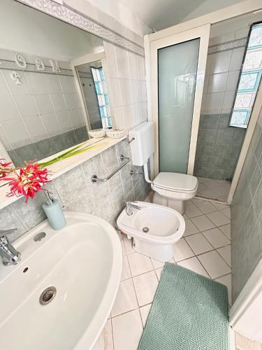 a bathroom with a sink and a toilet at Perla Sul Mare in Gallipoli