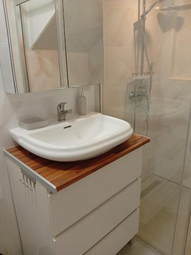 a bathroom with a white sink and a shower at Casa del Abuelo in Tabernas
