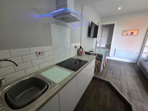 a kitchen with a sink and a counter top at 159 Smart Apartments in Newark-on-Trent