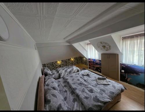 a bedroom with a bed and a couch in it at Apartment Đina in Plužine