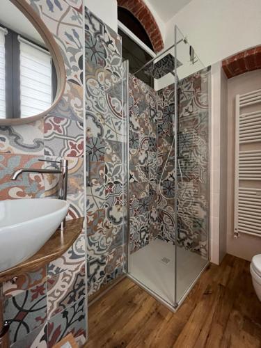 a bathroom with a shower and a sink at Stanza in sondrio Coel in Sondrio