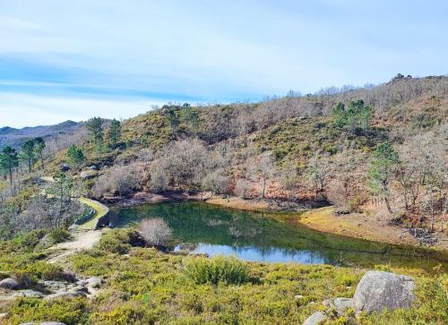 a river in the middle of a mountain at Casa do Rio, Natureza - Nova Gestão in Melgaço