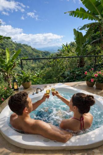 a man and woman drinking champagne in a bathtub at Kayala Domes - Unique Luxury Domes in the Mountains - 4x4 recommended in La Ese