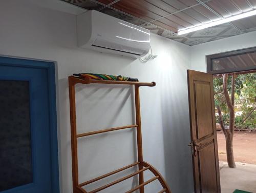 a ladder in a room with a ceiling at Wilpattu Buma Lodge in Pahala Maragahawewa
