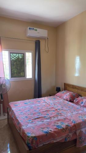 Maison d'Afrique tesisinde bir odada yatak veya yataklar