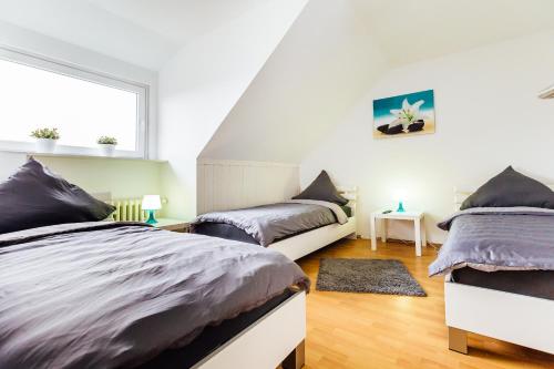 Ένα ή περισσότερα κρεβάτια σε δωμάτιο στο Apart2Stay Dormagen