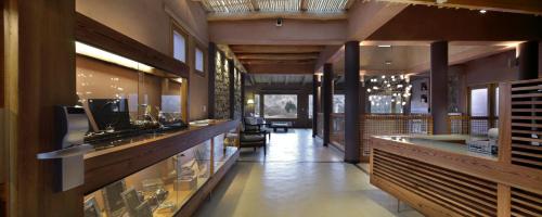 a lobby of a restaurant with a counter and a unintention at Las Marías Hotel Boutique in Tilcara