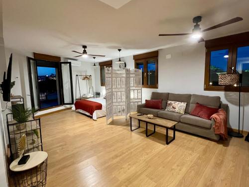 a living room with a couch and a table at Almamater salamanca in Salamanca