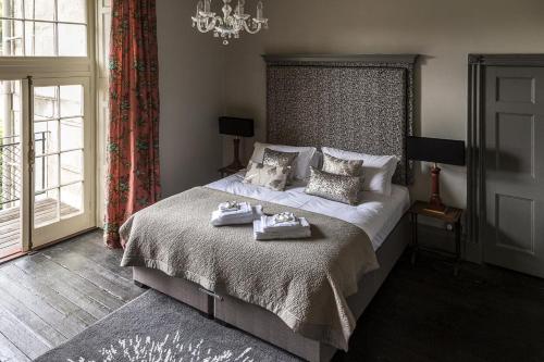 a bedroom with a bed with two towels on it at 1 Bed in Bath oc-bhr33 in Bath