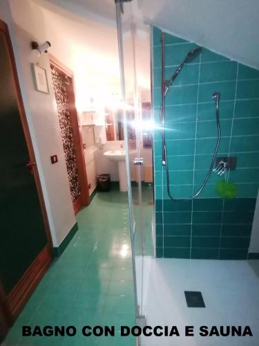 a bathroom with a shower with a glass door at casaNARDIELLO in Capua