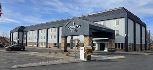 a building with a parking meter in a parking lot at Country Inn & Suites by Radisson, Idaho Falls at the Mall in Idaho Falls