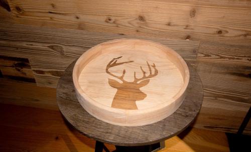 a cake with a deer on it on a table at Premium Apartment Grischuna 1-8 Pers in Klosters