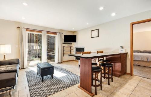 a living room with a table and chairs and a couch at Ground level Condo near Downtown Bend in Bend