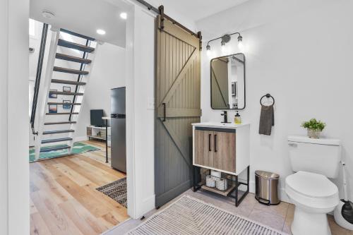 a bathroom with a toilet and a staircase at Old Rag Mountain Getaway - WiFi, Smart TV, Fire Pit, Patio, & Full Kitchen in Etlan