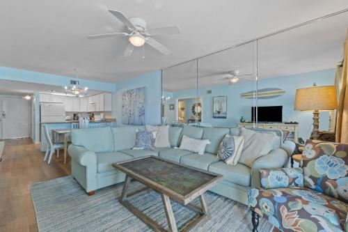 a living room with a couch and a table at Perdido Dunes 21 by Vacation Homes Collection in Orange Beach