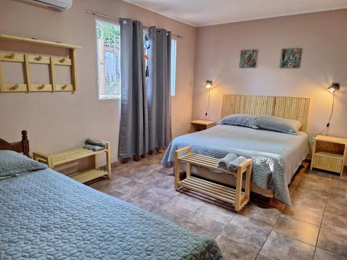 a bedroom with two beds and a window at DaLi in Montecarlo