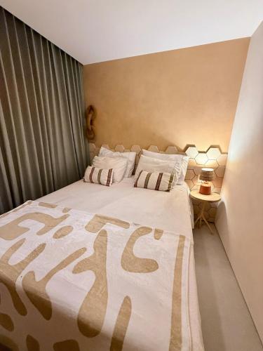 a bedroom with a large bed in a room at Diamantino Residence - Barro in Mucugê