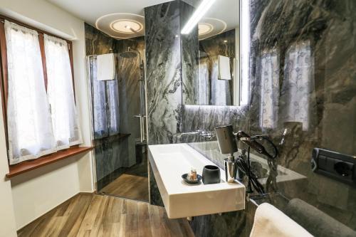 a bathroom with a sink and a shower at Affittacamere Ca Stella Antares a La Morra centro in La Morra