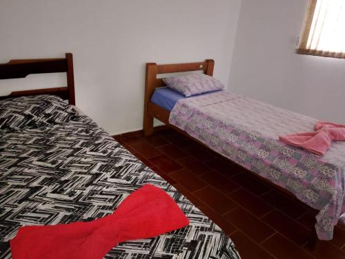 Giường trong phòng chung tại Real Hotel do Tatico