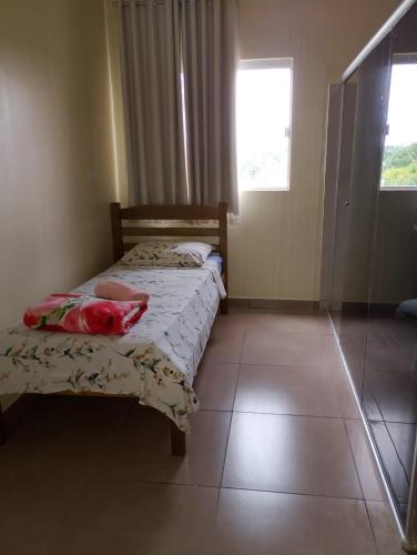 Giường trong phòng chung tại Real Hotel do Tatico